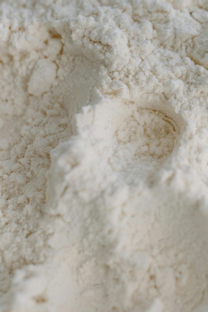 pexels photo 7110136 7110136 Detailed close-up of white flour with visible texture and powdery appearance.